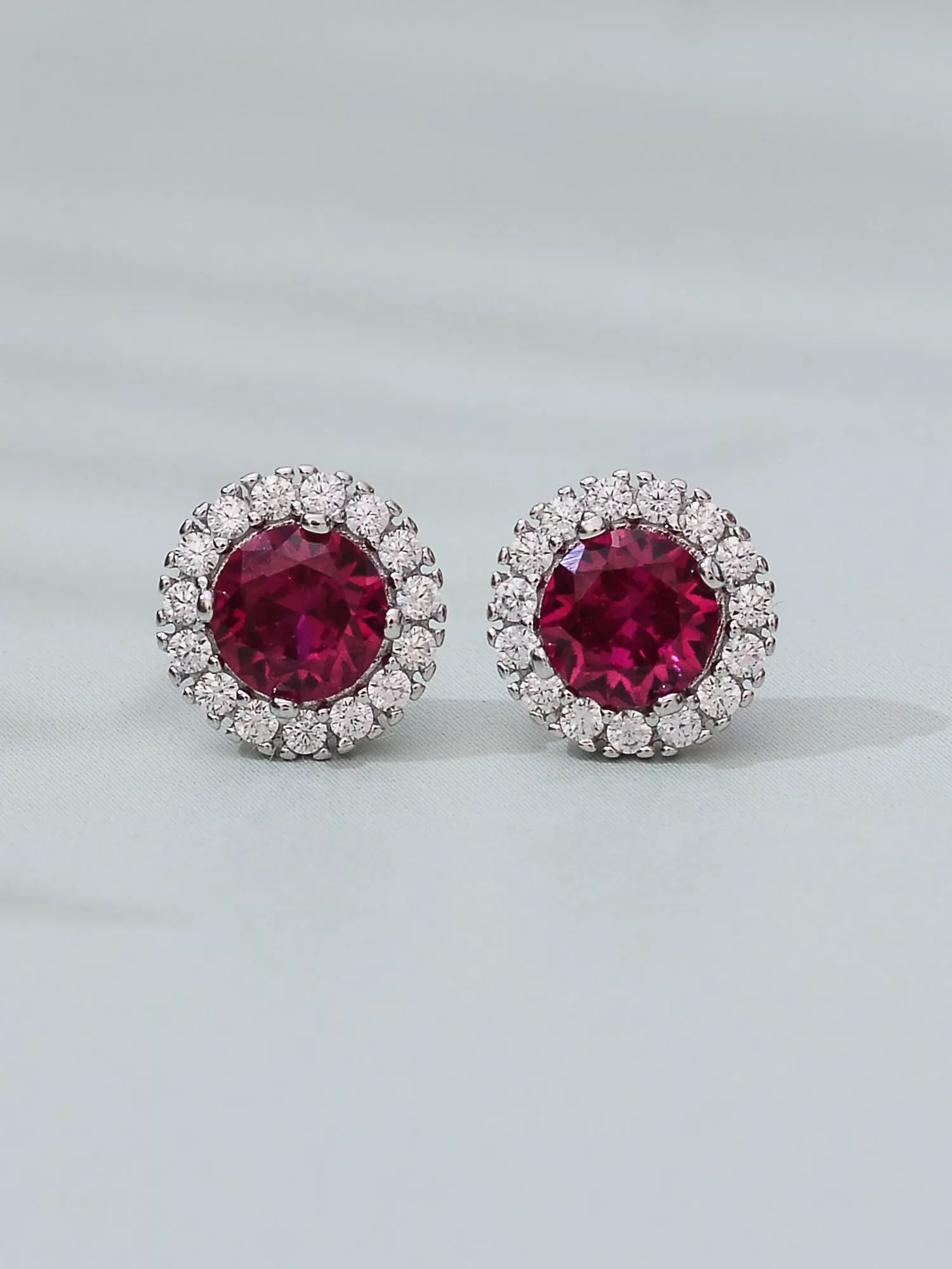 Created Ruby And American Diamond Halo Earrings In 925 Silver